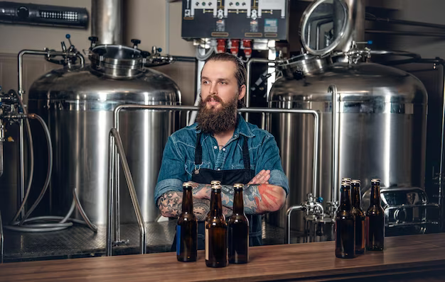 A man in a beer shop among bottles